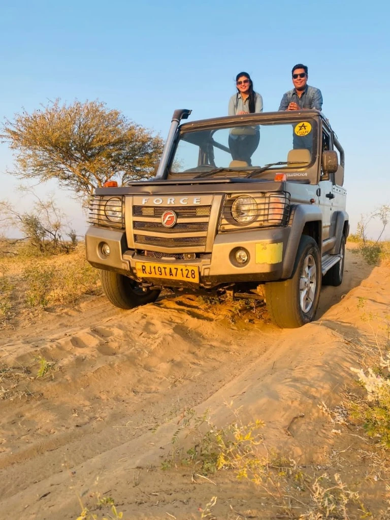 Open Force Gurkha 4x4 safari jeep in Thar Desert dunes at Camp Thar